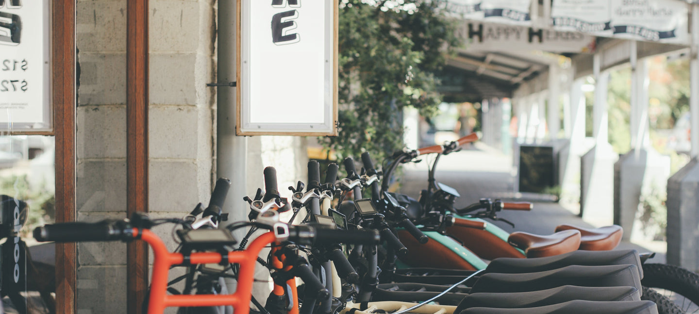 Byron Bay Bike Hire Fleet. Freedom Machines rental bike fleet sitting outside the bike hire shop 'Freedom machine'